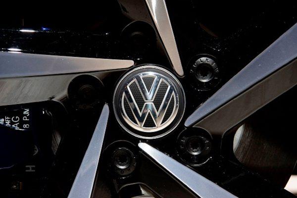 A Volkswagen logo appears on the wheel of a VW Passat GTE Variant on display at the annual general meeting of German car manufacturing giant Volkswagen in Berlin on May 14, 2019. (John Macdougall/AFP/Getty Images)