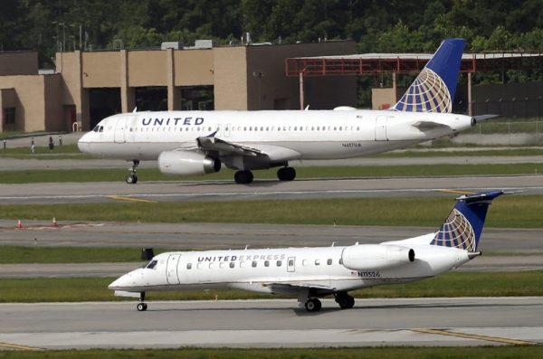 United Airlines and United Express planes prepare to take off at George Bush Intercontinental Airport in Houston, on July 8, 2015. (David J. Phillip/AP/File)