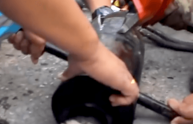 Video: Puppy Gets Stuck in Exhaust Pipe and Has to Be Rubbed in Shampoo to Be Freed