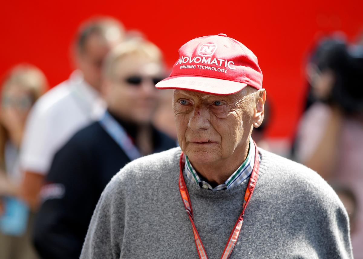Former Formula One World Champion Niki Lauda of Austria walks in the paddock before the third free practice at the Silverstone racetrack, Silverstone, England, on July 7, 2018. (AP Photo/Luca Bruno, File)