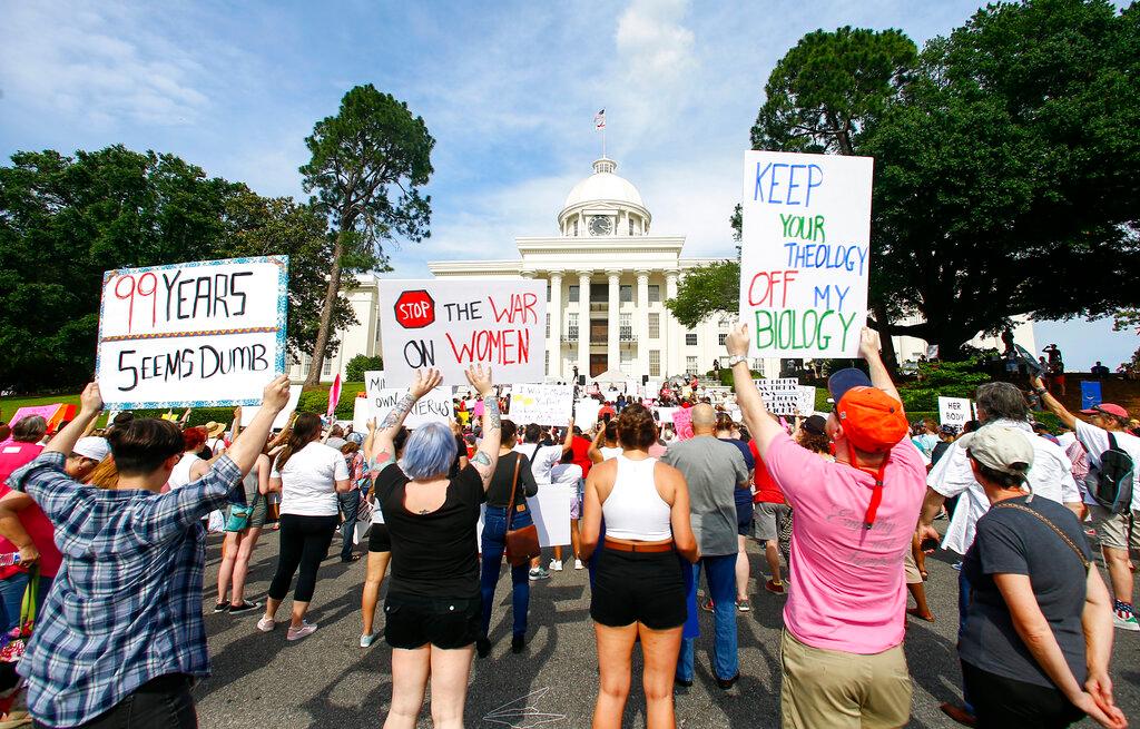 Protesters calling for abortion to be legalized hold a rally on the Alabama Capitol steps in Montgomery, Ala., on May 19, 2019. (AP Photo/Butch Dill)