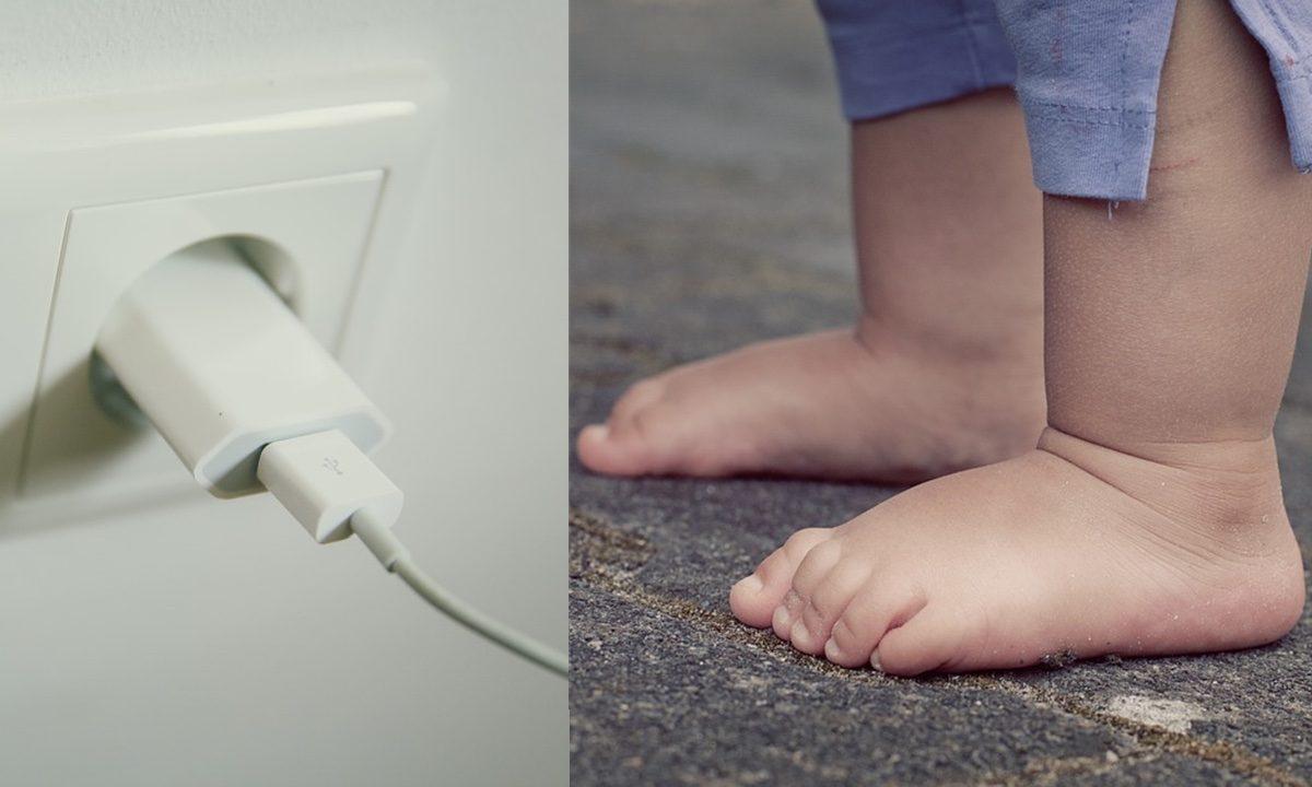 Stock image of a cellphone charger and a toddler. (Pixabay)