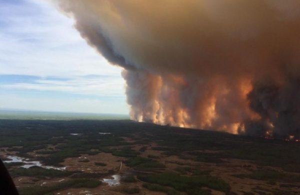 The Chuckegg Creek fire is seen from the air in a Government of Alberta handout photo taken near the town of High Level, AB. on May 19, 2019. (Ho/The Canadian Press)