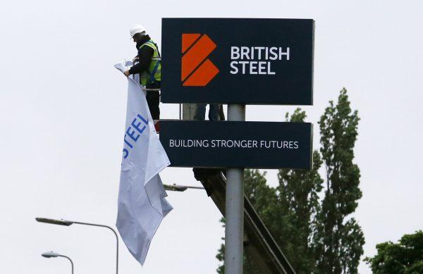 The new British Steel sign is unveiled at the main entrance at the newly-branded British Steel steelworks plant in Scunthorpe, northeast England, on June 1, 2016. (Lindsey Parnaby/AFP/Getty Images)