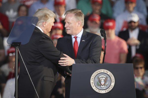 President Donald Trump shakes hands with Fred Keller, Republican candidate for Congress in Pennsylvania's 12th Congressional district, during a 'Make America Great Again' campaign rally at Williamsport Regional Airport, in Montoursville, Pa., on May 20, 2019. (Drew Angerer/Getty Images)