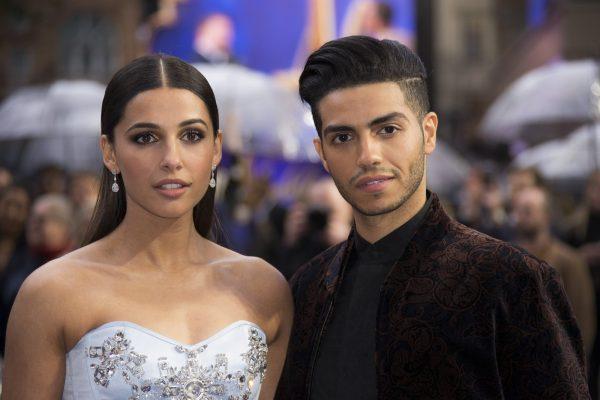 Actors Naomi Scott (L) and Mena Massoud pose for photographers upon arrival at the "Aladdin" European Gala premiere in London, on May 9, 2019. (Photo by Joel C Ryan/Invision/AP)