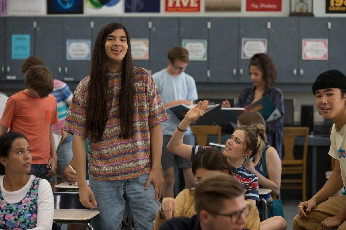 Eduardo Franco (L, standing) as Theo and Molly Gordon (hand raised) as Triple A in Olivia Wilde’s directorial debut, “Booksmart.” (Francois Duhamel/Annapurna pictures, LLC)