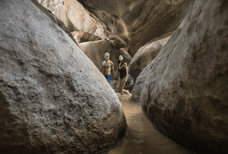 Exploring amid the granite boulders at The Baths National Park. (Courtesy of BVI Tourist Board)