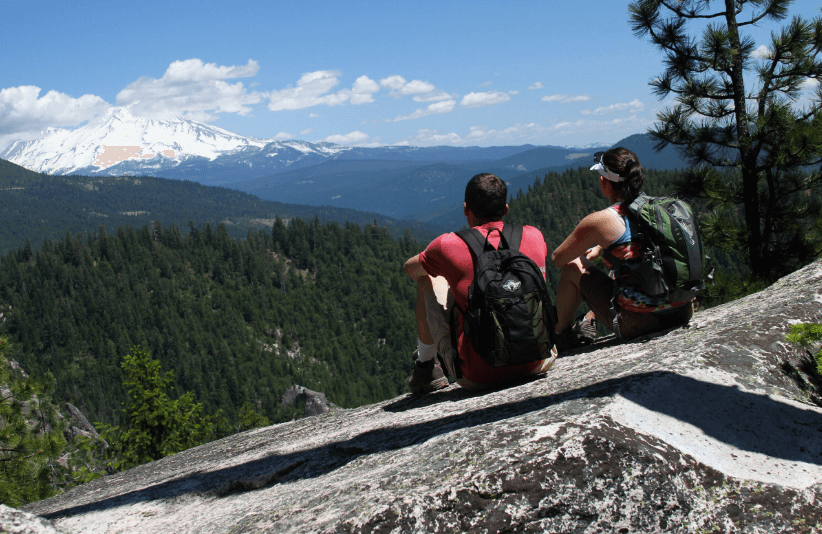 Hikers take in the view along their Castle Crags hike. (Courtesy of Visit Redding)