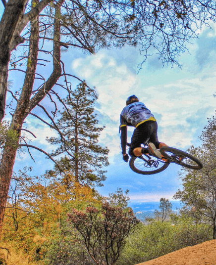 Ryan Schuppert gets some air during a ride on the Enticer Trail in Redding. (Mark Ruffell)