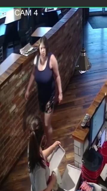 The woman is pictured walking through the restaurant in Kennewick, Washington, on May 19, 2019. (Kennewick Police)
