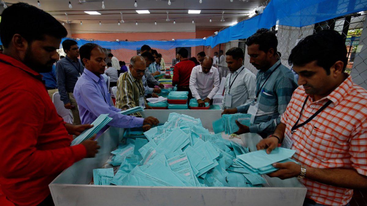 Election staff members sort ballot papers before counting them inside a vote counting centre in Ahmedabad, India on May 23, 2019. (Amit Dave/Reuters)
