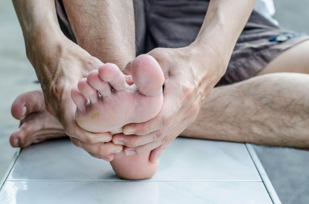 Illustration - Shutterstock | <a href="https://www.shutterstock.com/image-photo/mans-hand-being-massaged-foot-324868229">chingyunsong</a>
