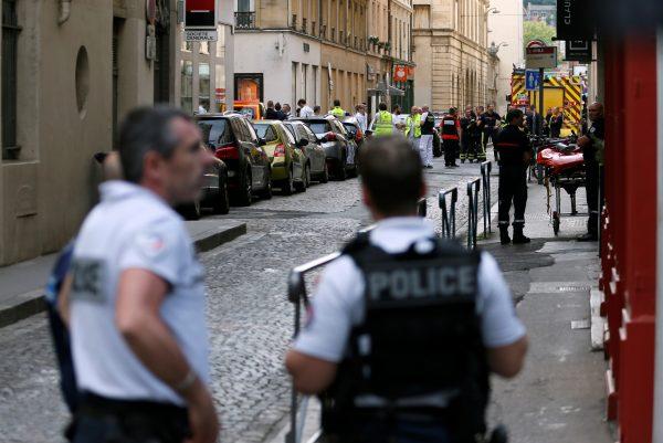 Police officers, fire fighters and medics are seen near the site of a suspected bomb attack in central Lyon, France, on May 24, 2019. (Emmanuel Foudrot/Reuters)