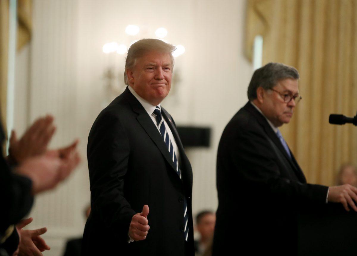 President Donald Trump (L) stands with Attorney General William Barr before the presentation of the Public Safety Officer Medals of Valor in the East Room of the White House on May 22, 2019. (Mark Wilson/Getty Images)