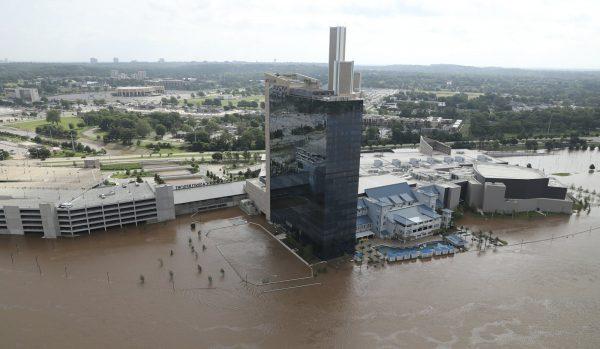 The River Spirit Hotel and Casino has flood waters surrounding it on the Arkansas River in Tulsa, Okla., on Friday, May 24, 2019. (Tom Gilbert/Tulsa World via AP)