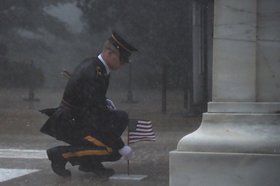 Severe Thunderstorm Didn’t Deter This Soldier From Placing Flag at Tomb of the Unknown