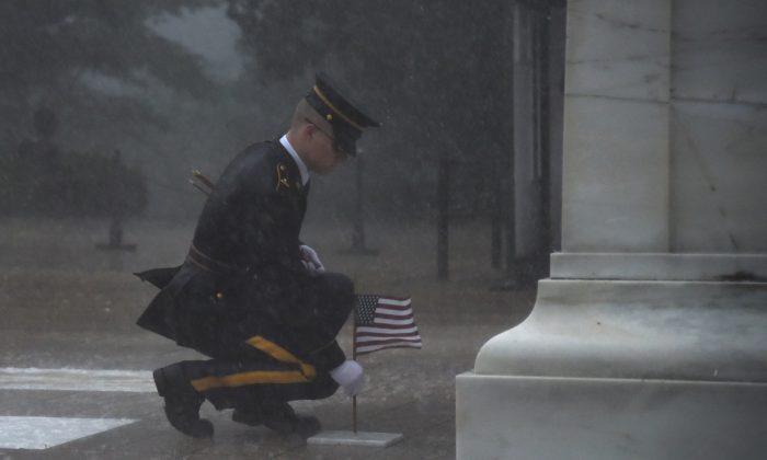 Severe Thunderstorm Didn’t Deter This Soldier From Placing Flag at Tomb of the Unknown