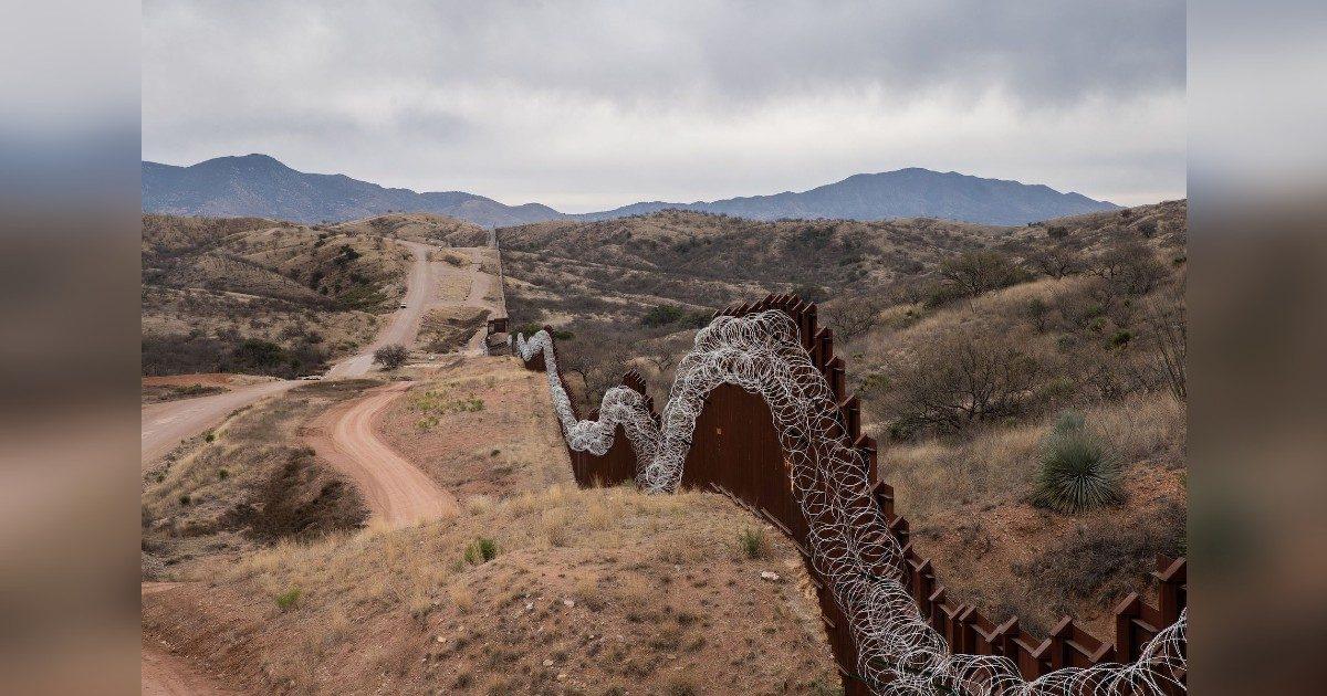 A general view of the US border fence, covered in concertina wire, separating the US and Mexico, at the outskirts of Nogales, Arizona, on Feb. 9, 2019. (Ariana Drehsler/AFP/Getty Images)
