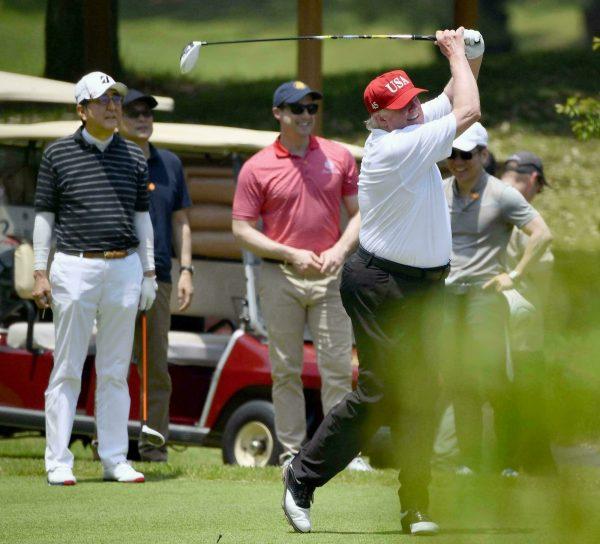 President Donald Trump, right, plays golf with Japanese Prime Minister Shinzo Abe, left, at Mobara Country Club in Mobara, south of Tokyo, Japan on May 26, 2019. (Ren Onuma/Kyodo News via AP)