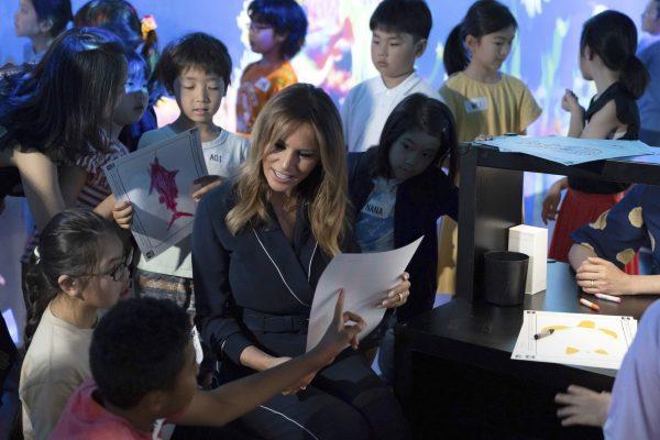 U.S. First Lady Melania Trump chats with children as she visits a digital art museum in Tokyo, Japan on May 26, 2019. (Koji Sasahara/AP)