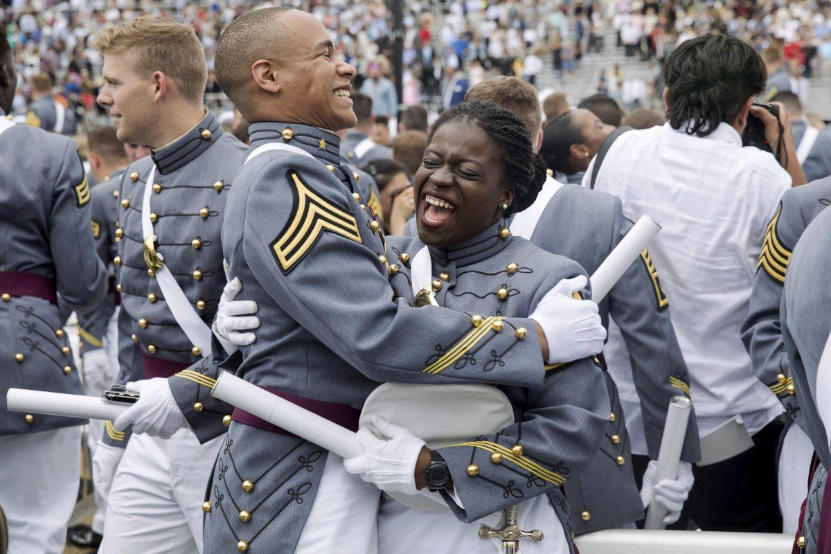 West Point cadets hug each other at the end of graduation ceremonies at the United States Military Academy, in West Point, N.Y., on May 25, 2019. (Julius Constantine Motal/AP Photo)