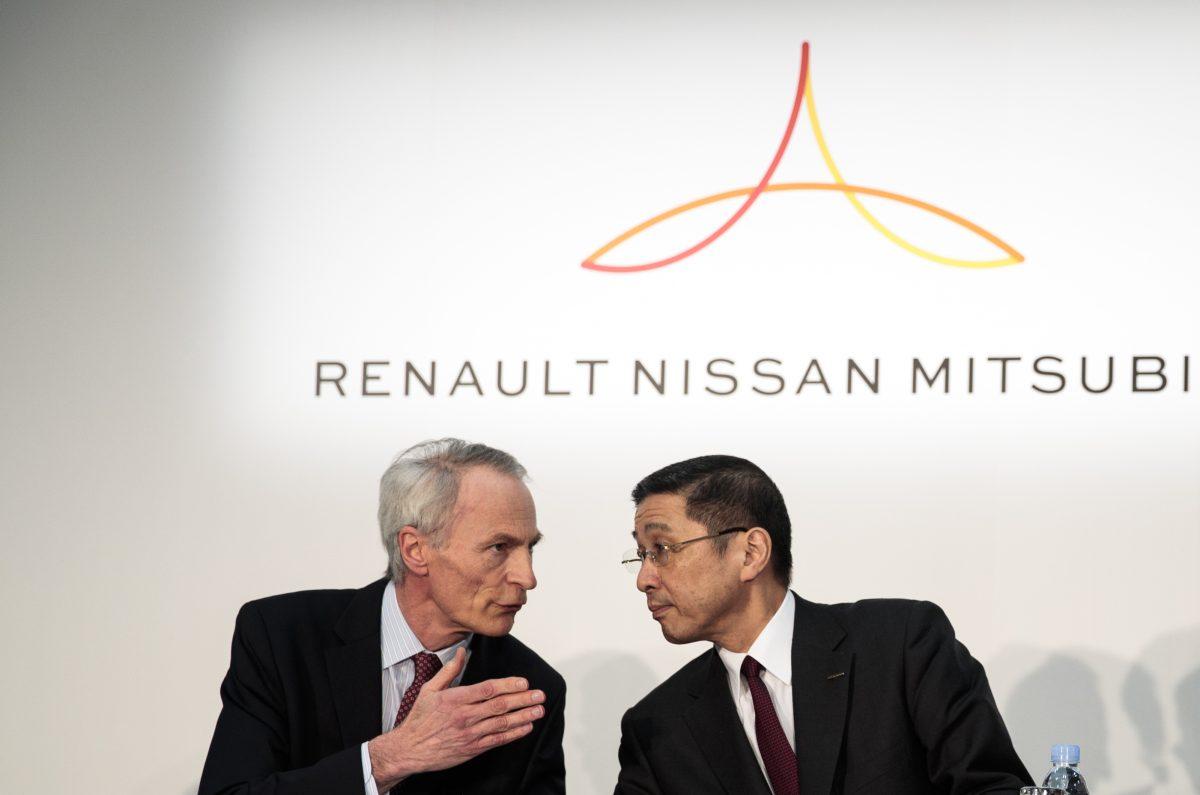 Renault chairman Jean-Dominique Senard (L) and Nissan Motors president and CEO Hiroto Saikawa (R) chat during a press conference at the Nissan headquarters in Yokohama, Kanagawa prefecture on March 12, 2019. (Behrouz Mehri/AFP/Getty Images)