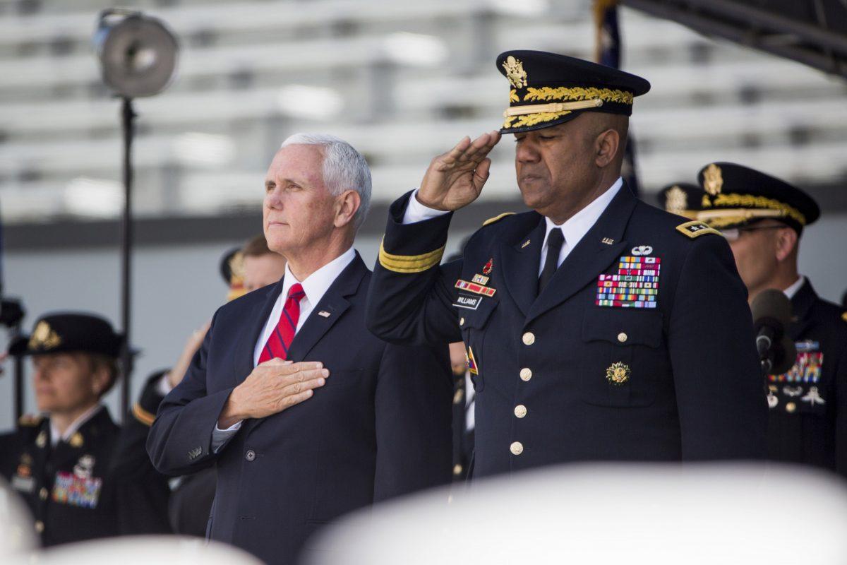 Vice President Mike Pence stands for the national anthem during graduation ceremonies at the United States Military Academy, in West Point, N.Y., on May 25, 2019. (Julius Constantine Motal/AP Photo)