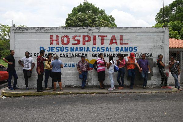 Relatives of prisoners killed during clashes at a police station jail in the town of Acarigua, in the Venezuelan state of Portuguesa, wait outside a hospital's morgue to be handed the bodies of their loved ones, on May 25, 2019. (Marvin Recinos/AFP/Getty Images)