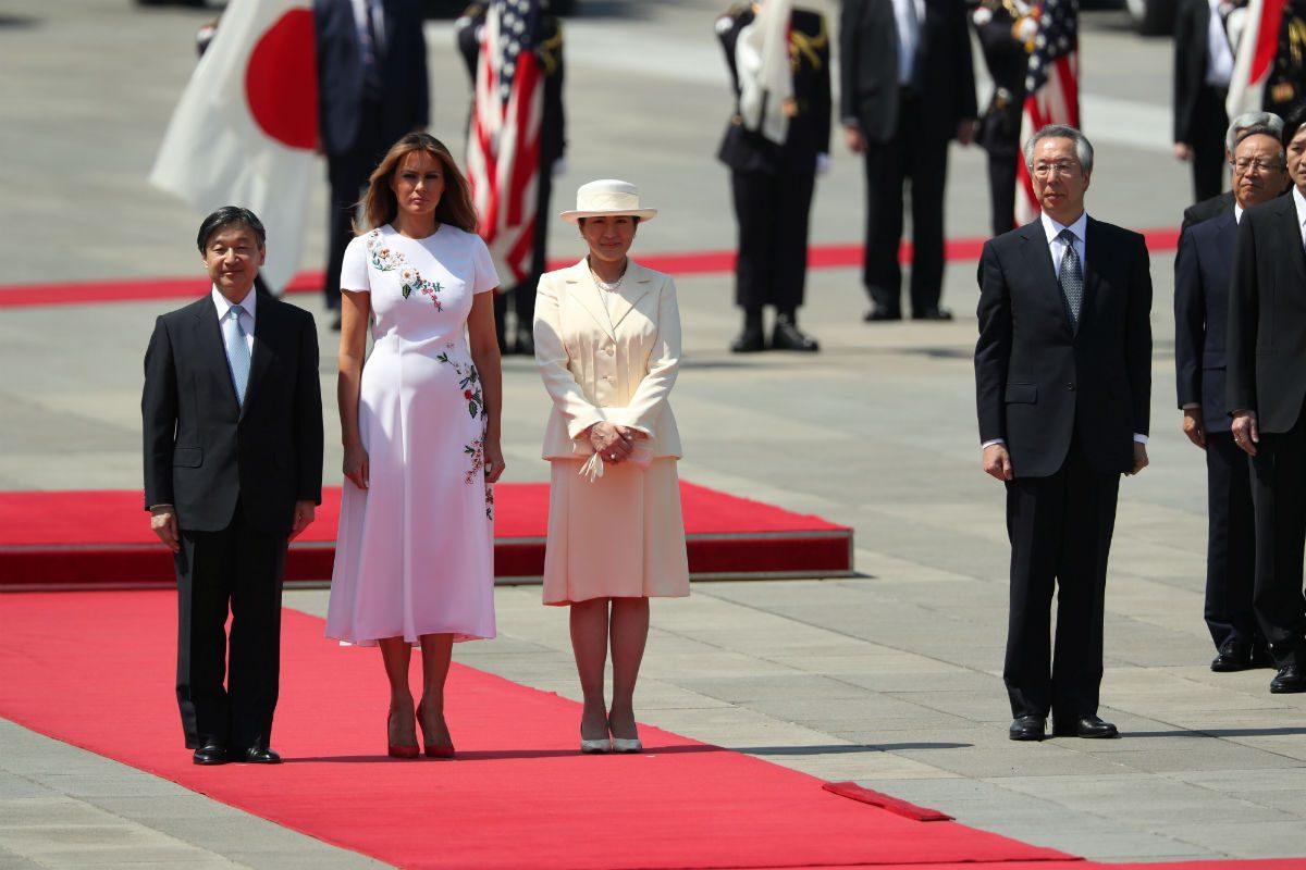 First Lady Melania Trump stands next to Japan's head of state Naruhito and his wife Masako as President Donald Trump walks to inspect an honor guard at the royal palace in Tokyo, Japan on May 27, 2019. (Jonathan Ernst/Reuters)