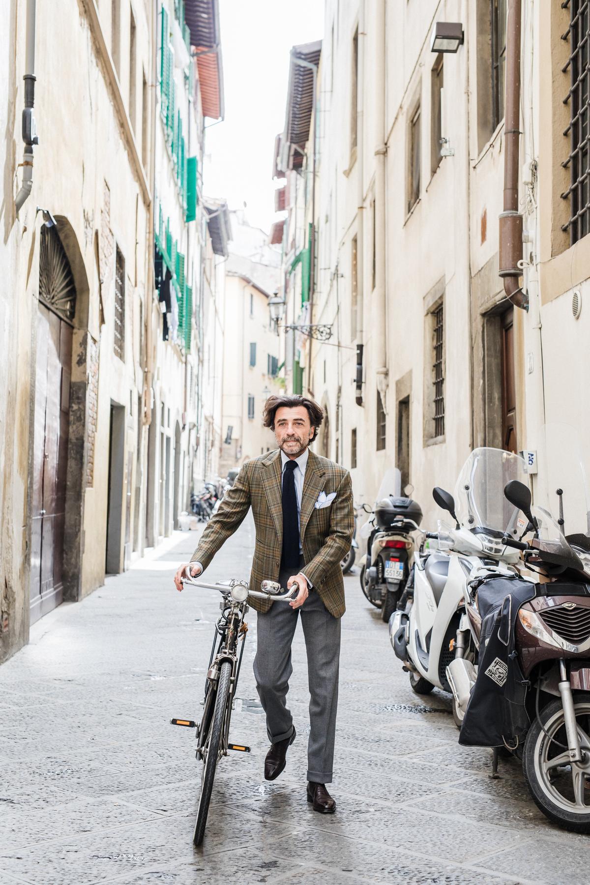 Tommaso Capozzoli, partner and brand ambassador at Sartoria Vestrucci, wearing a ready-to-wear tweed sport coat ($2,700), made-to-measure cotton shirt ($270), wool knit tie ($112), and ready-to-wear flannel trousers ($570). (Courtesy of Sartoria Vestrucci)