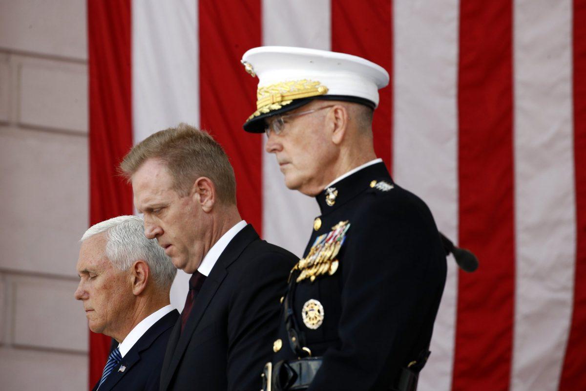 Vice President Mike Pence, from left, Acting Defense Secretary Patrick Shanahan and Joint Chiefs Chairman Gen. Joseph Dunford pause during a prayer, Monday, May 27, 2019. (AP Photo/Patrick Semansky)