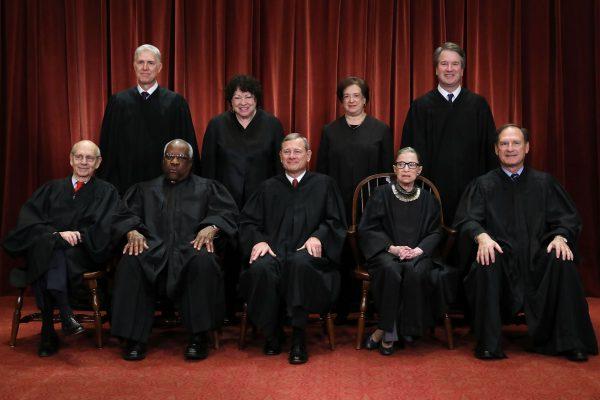 United States Supreme Court (Front L-R) Associate Justice Stephen Breyer, Associate Justice Clarence Thomas, Chief Justice John Roberts, Associate Justice Ruth Bader Ginsburg, Associate Justice Samuel Alito, Jr., (Back L-R) Associate Justice Neil Gorsuch, Associate Justice Sonia Sotomayor, Associate Justice Elena Kagan and Associate Justice Brett Kavanaugh. (Chip Somodevilla/Getty Images)