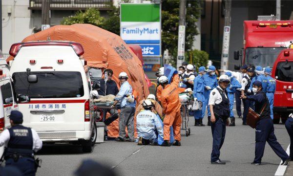 Rescue workers and police officers operate at the site where sixteen people were injured in a suspected stabbing by a man, in Kawasaki, Japan May 28, 2019. (Kyodo/via REUTERS)