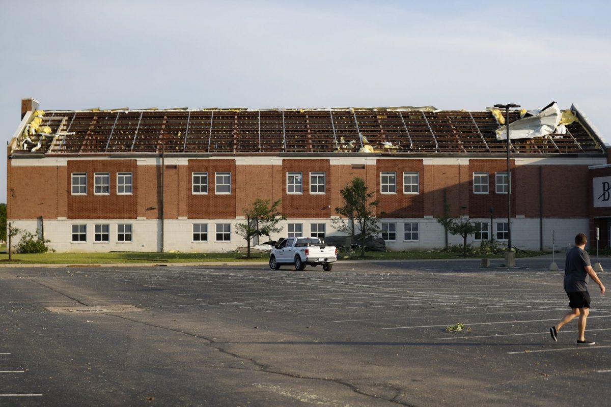 A section of roof remains torn from Brookville High School after a tornado hit the area the previous evening in Brookville, Ohio, on May 28, 2019. (John Minchillo/AP Photo)