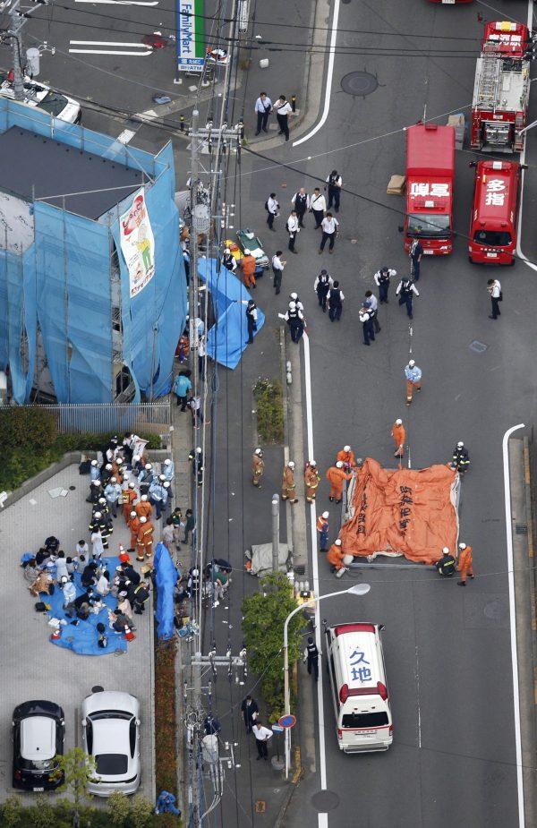 An aerial view shows rescue workers and police officers operate at the site where sixteen people were injured in a suspected stabbing by a man, in Kawasaki, Japan, on May 28, 2019. (Kyodo/via REUTERS)