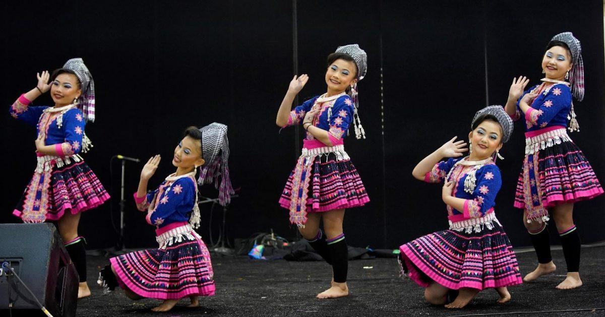 Girls from the Hmong ethnic group performing their traditional dance.  (Lei Chen)