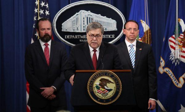Attorney General William Barr speaks about the release of the redacted version of the Mueller report as Deputy Attorney General Rod Rosenstein (R) and Acting Principal Associate Deputy Attorney General Ed O’Callaghan listen at the Department of Justice in Washington on April 18, 2019. (Win McNamee/Getty Images)