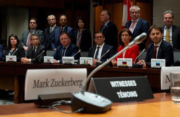 Standing Committee on Access to Information, Privacy and Ethics Chair Bob Zimmer and members of the International Grand Committee on Big Data, Privacy and Democracy listen to a question from media during a news conference in Ottawa, Tuesday, May 28, 2019. (Adrian Wyld/The Canadian Press)