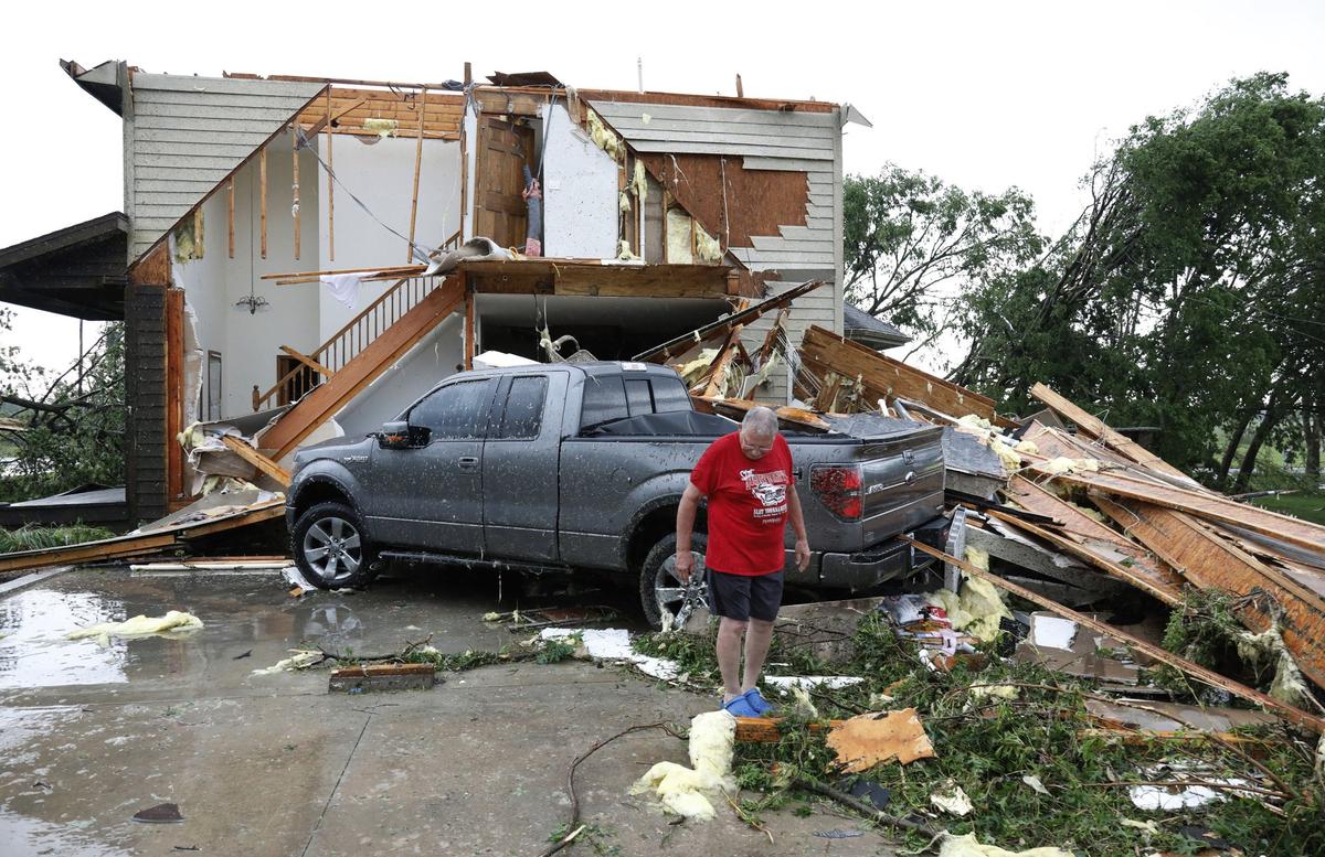 Joe Armison looks over damage to his home after a tornado struck the outskirts of Eudora, Kan., Tuesday, May 28, 2019. (Colin E. Braley/AP)