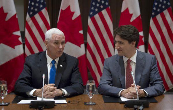 Canadian Prime Minister Justin Trudeau listens as U.S. Vice President Mike Pence makes opening remarks at the Canadian Council for the USMCA on Parliament Hill in Ottawa on May 30, 2019. (Adrian Wyld/The Canadian Press)