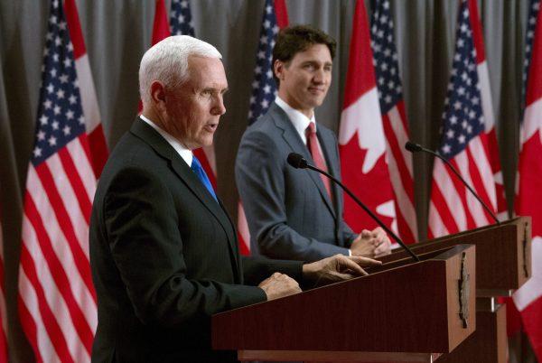 Canadian Prime Minister Justin Trudeau listens as U.S. Vice-President Mike Pence makes his opening statement during a joint news conference in Ottawa on May 30, 2019. (Adrian Wyld/The Canadian Press)