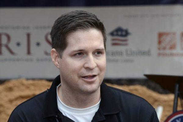 U.S. Air Force Sr. Airman Brian Kolfage, speaks with the media during a 2016 groundbreaking ceremony for a new home he and his family were receiving through the Gary Sinise Foundation's RISE program at Sandestin, Fla., on Jan. 14, 2016. (Devon Ravine/Northwest Florida Daily News via AP)