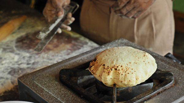 Fulka roti, puffed up over a flame. (Shutterstock)