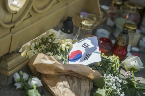 Flowers and candles are left in memory of the victims on the Margaret Bridge, the spot of the accident involving South Korean tourists, in Budapest, Hungary, May 2019. (Zoltan Balogh/MTI via AP)