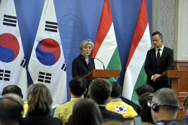 South Korean Foreign Minister Kang Kyung-wha, left, and Hungarian Minister of Foreign Affairs and Trade Peter Szijjarto hold a press conference following their extraordinary meeting in Szijjarto's office in Budapest, Hungary, on May 31, 2019. (Attila Kovacs/MTI via AP)