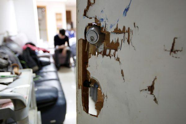 The smashed door of an office rented by several independence activists is pictured in Hong Kong, China on Jan. 4, 2019. (James Pomfret/Reuters)