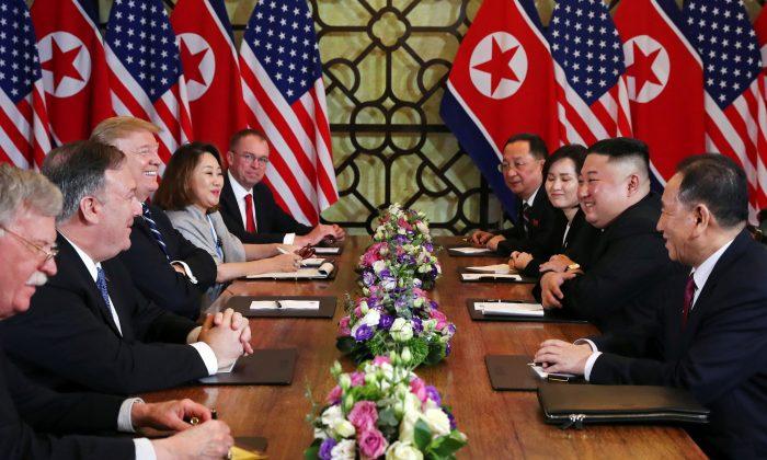 President Donald Trump and North Korea’s leader Kim Jong Un, along with their respective entourages, attend an extended bilateral meeting in the Metropole hotel during the second North Korea-U.S. summit in Hanoi, Vietnam, on Feb. 28, 2019. (Leah Millis/Reuters)