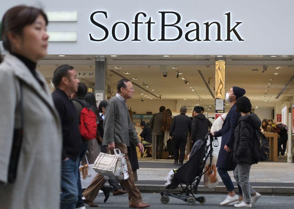 People walk in front of a shop of Japan's telecoms giant SoftBank in Tokyo on Nov. 23, 2018. (Kazuhiro Nogi/AFP/Getty Images)