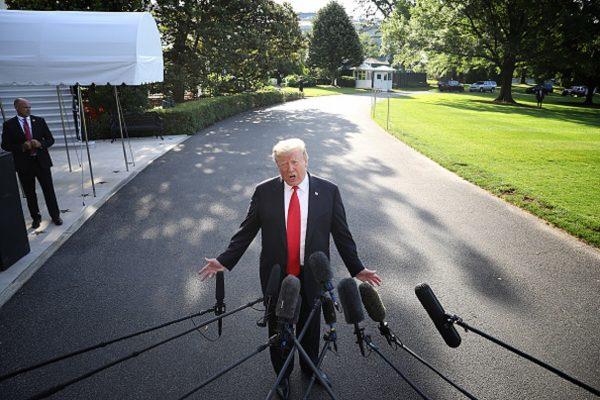 U.S. President Donald Trump answers questions on the comments of special counsel Robert Mueller while departing the White House in Washington, May 30, 2019. (Win McNamee/Getty Images)